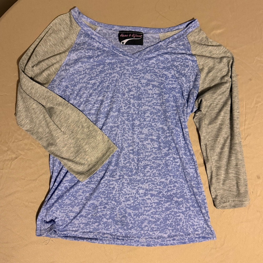 Purple with gray 3/4 sleeve jersey style t-shirt. Size Medium. Brand is Rebel.